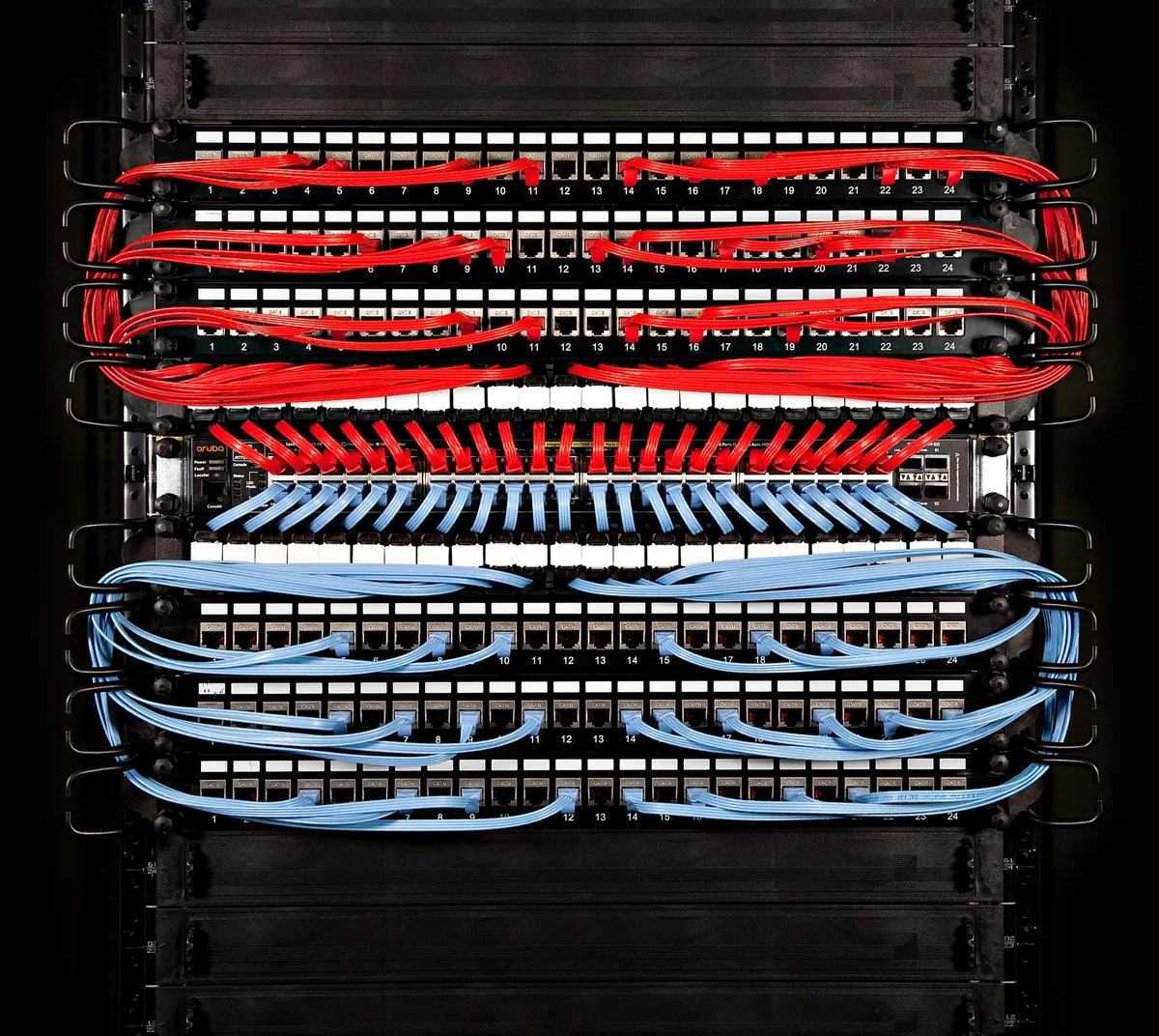 Patch panels with colour-coded network cabling
